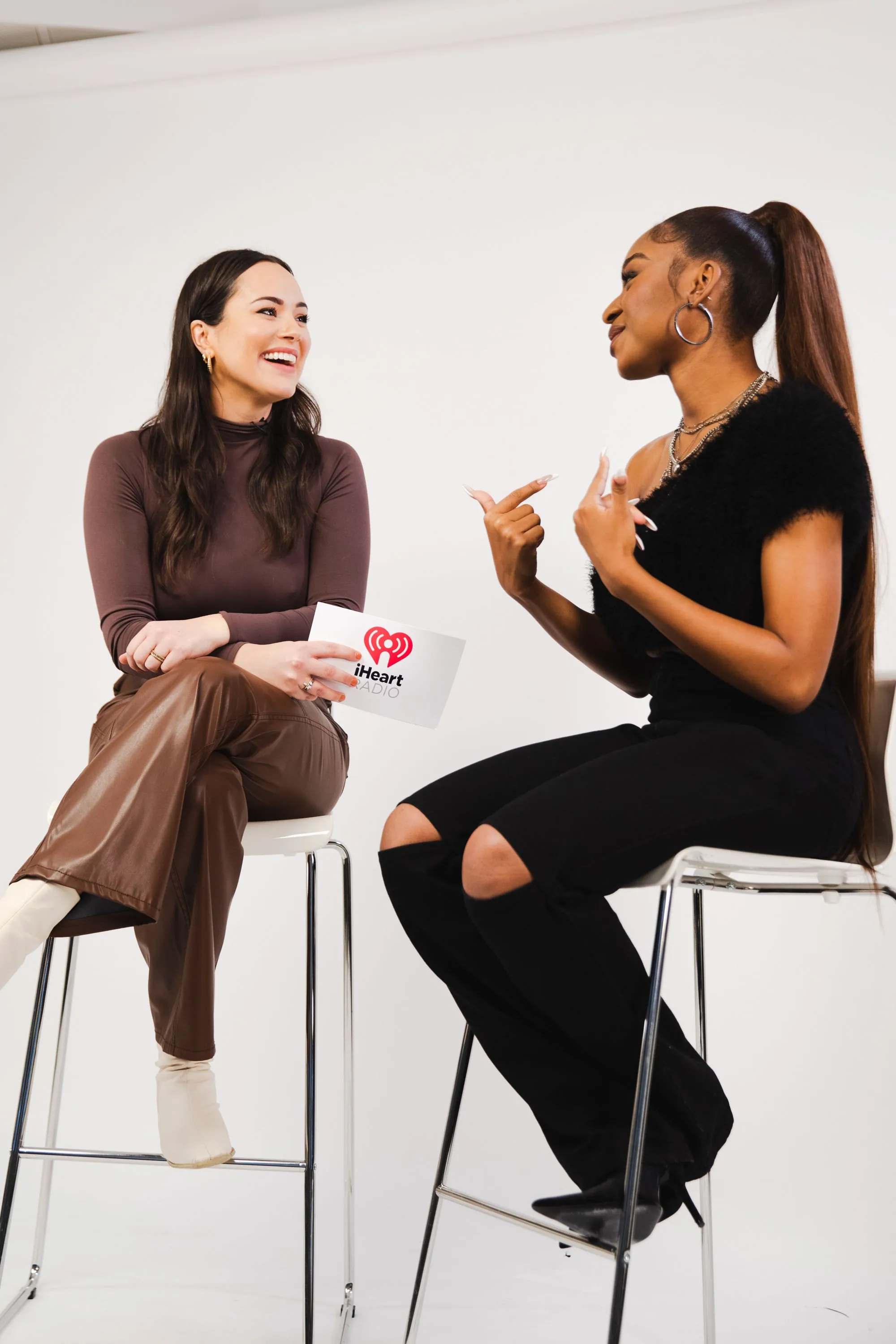 Curl smiles while interviewing singer Normani Kordei Hamilton 