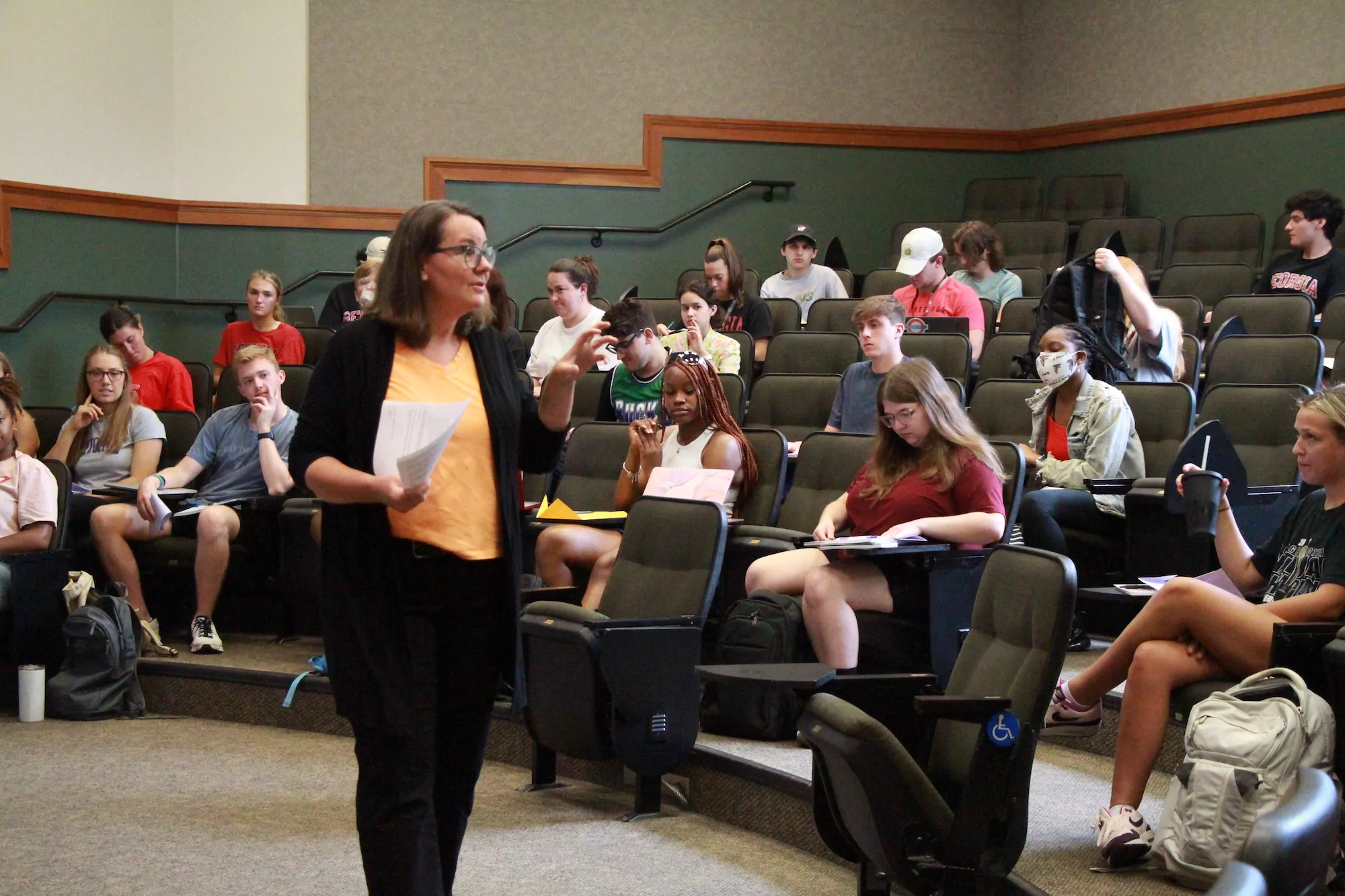 Karin Assmann teaches in front of her class.