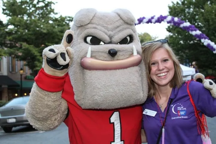 Caroline Edwards poses for a photo with Hairy Dawg during a Relay for Life event. 