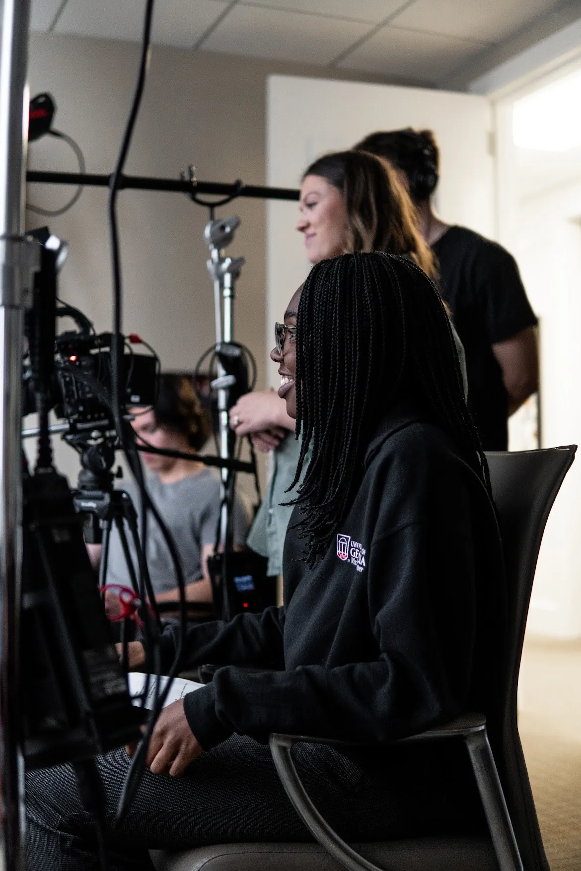 Chiamaka Uwagerikpe sitting in a chair in front of a camera.