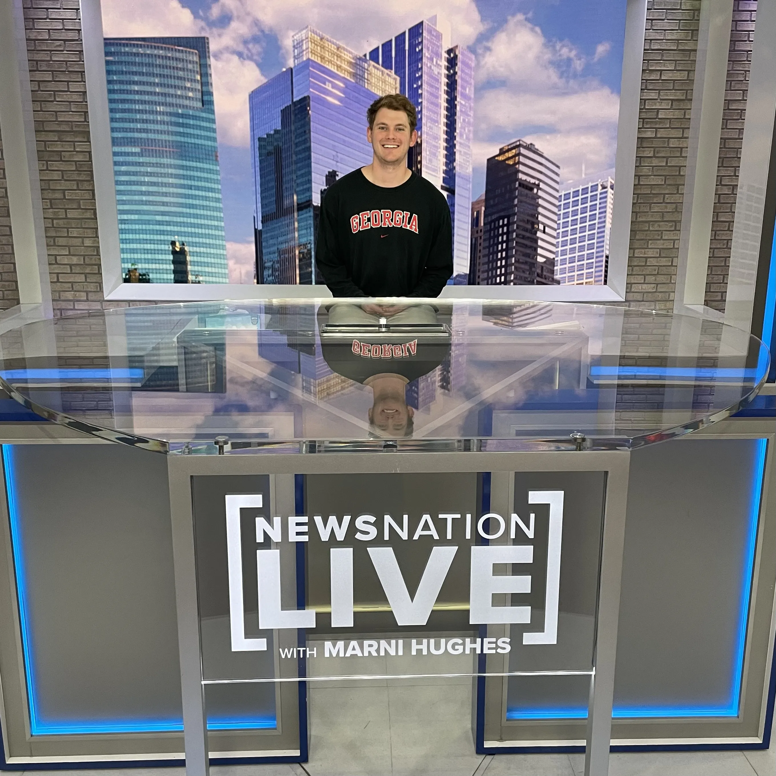 Student sitting at a NewsNation Live desk