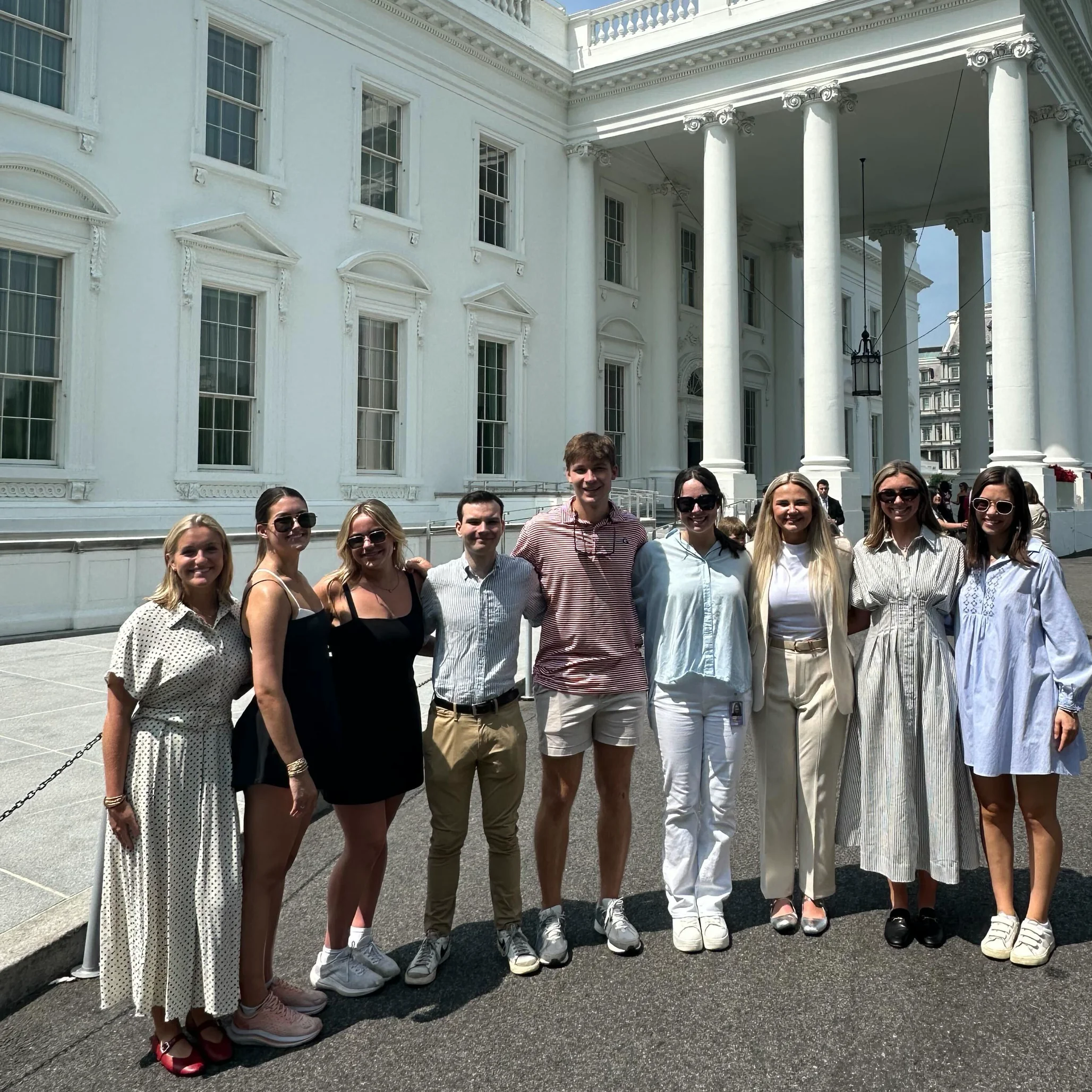 Students stand in front of the White House