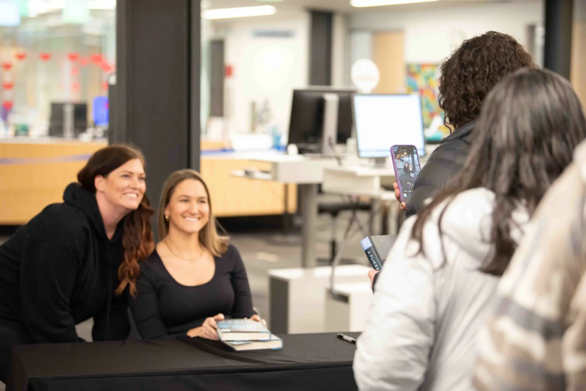 Two women posing for a picture.