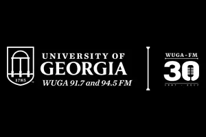 White text on a black background reads University of Georgia WUGA 91.7 and 94.5 FM with the university’s arch logo on the left and WUGA-FM 30 Forty Years with a microphone icon on the right.