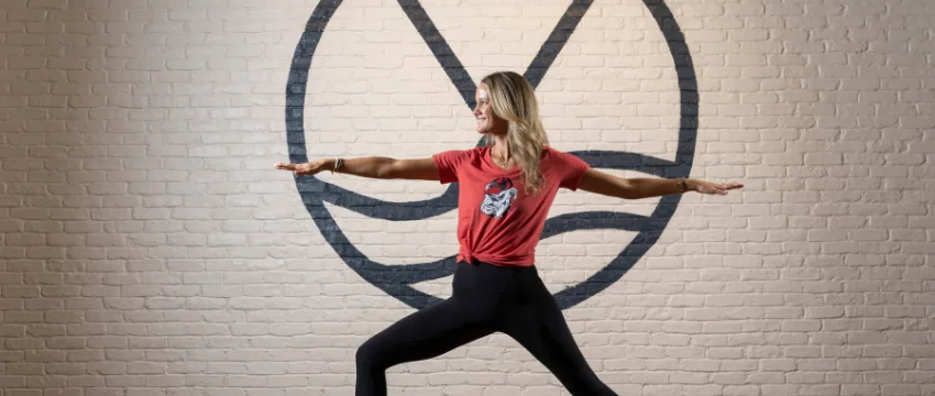 Selby Hill poses in a yoga stance at her studio, Yonder Yoga.