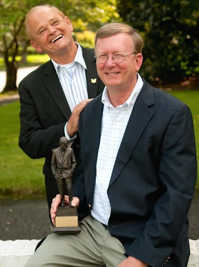 Ed Grisamore holds an trophy while Durwood "Mr. Doubletalk" Fincher looks on. 