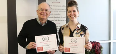 Keith Herndon and Charlotte Varnum hold up certificates presented by the Taste Awards. (Photo: Sarah Freeman)