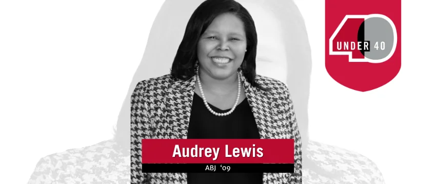 Audrey Lewis, smiling and wearing a patterned jacket and pearl necklace, is showcased with a 40 Under 40 badge beside her name and graduation year, ABJ 09, highlighted in bold red and white design elements.