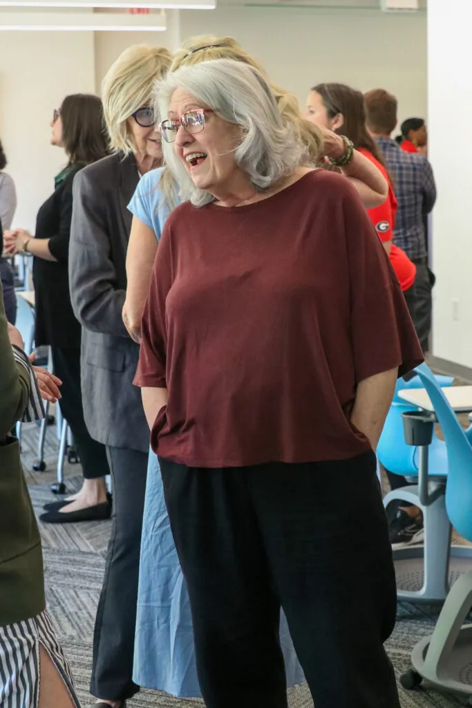 Sophie Barnes smiles as she talks with someone at the retirement reception.