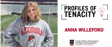 Anna Willeford poses in front of Sanford Stadium football field.