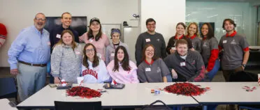 A group of people pose for a picture.