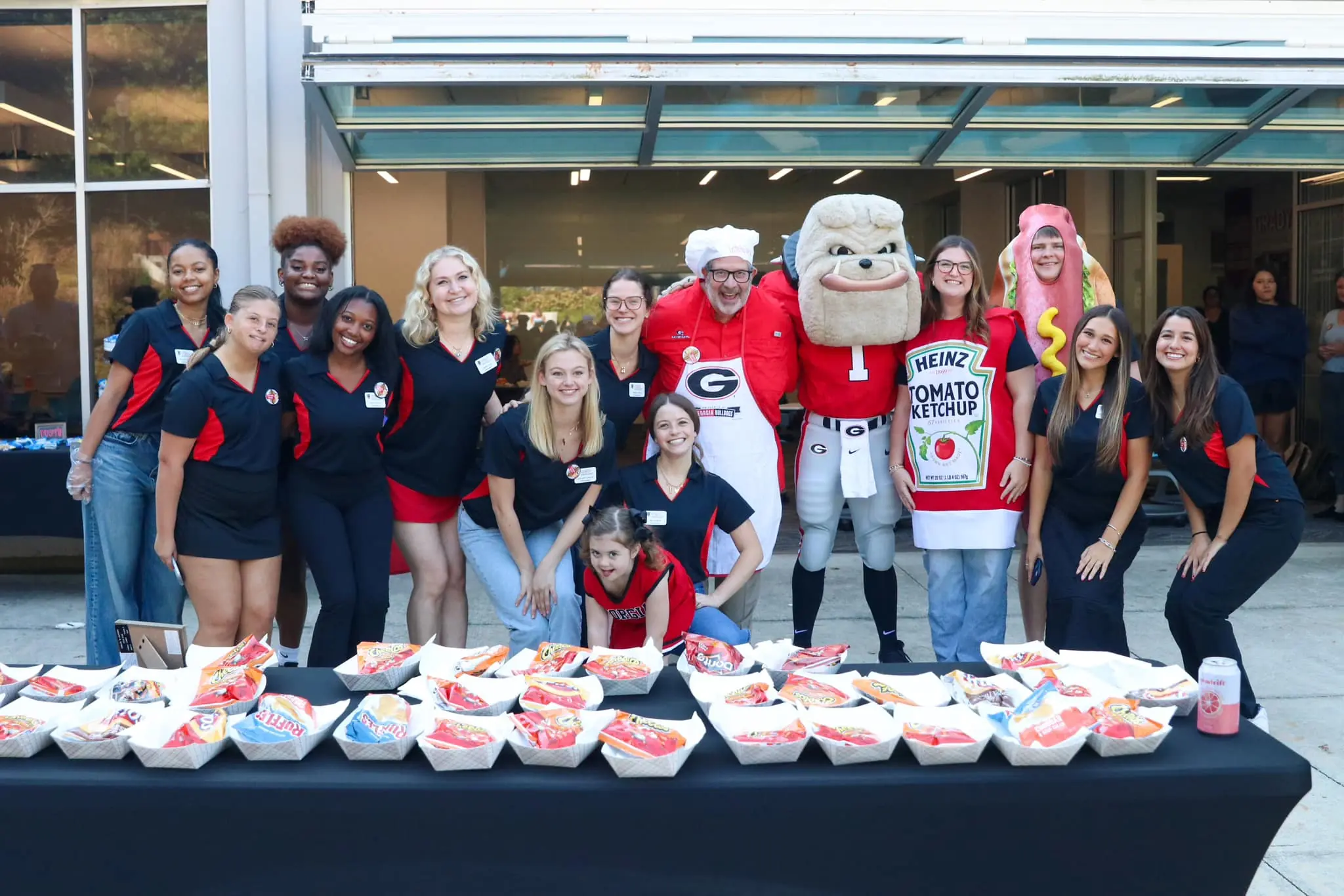 Natalie Hope poses with Hairy Dawg at the 2024 SEC Championship.