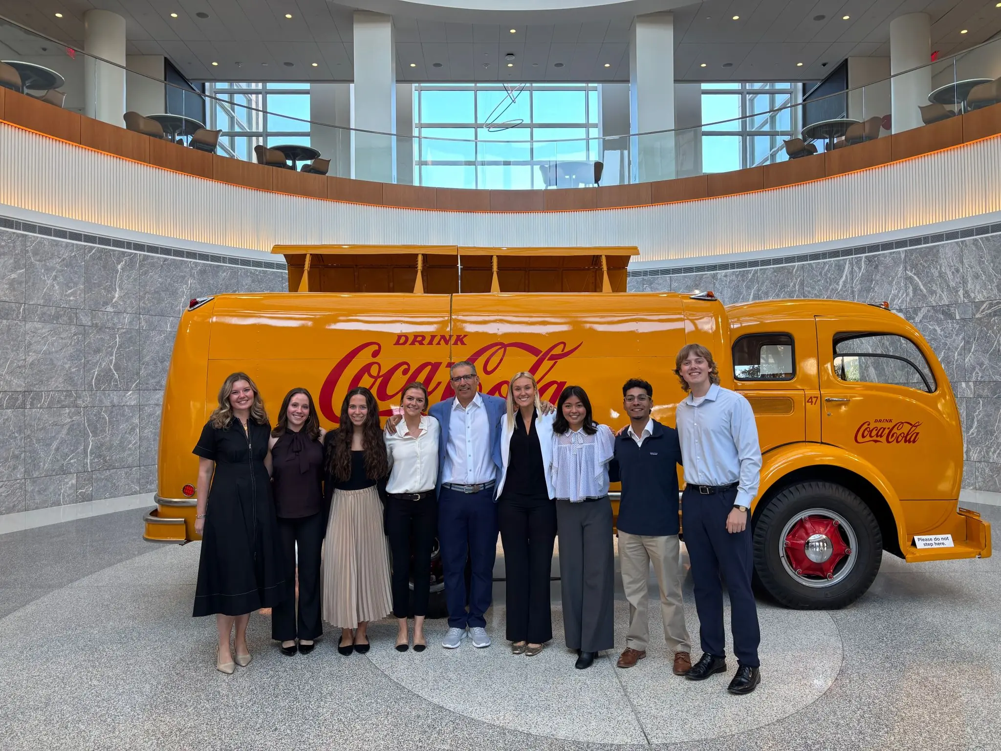 students in front of vintage Coca Cola truck