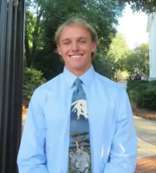 Headshot of Nicolas Wiles in front of UGA Arch