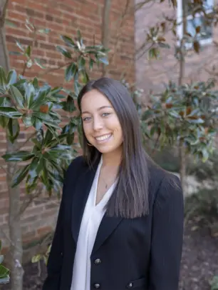 Lili Verma is pictured smiling for a headshot.