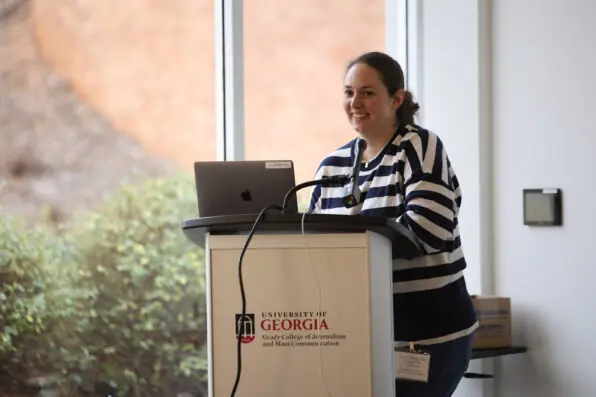 Sam Bresnahan speaks at a lectern.