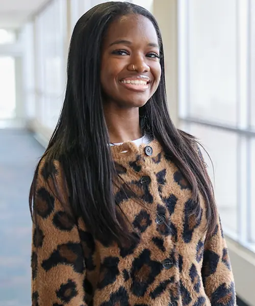 A young woman poses for a headshot photo.