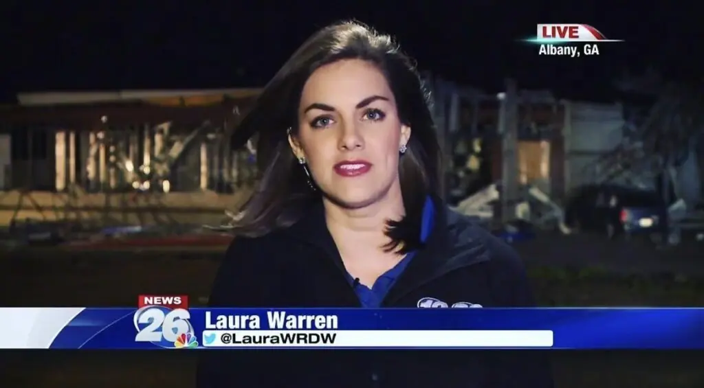 A female reporter speaks on live TV with a graphic showing her name is "Laura Warren" and a location in the top right that reads "Albany, Georgia."