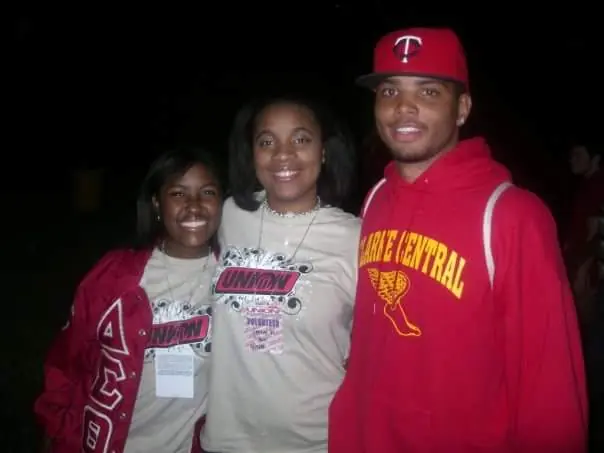 Renee Fuller stands alongside one woman and one man, who are both classmates of hers at the University of Georgia from the early-2000s.