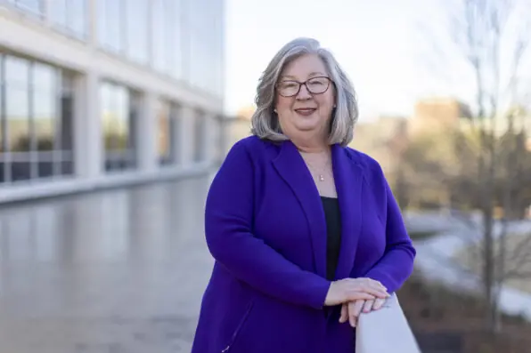An outdoor portrait of Mary Ellen Barto with Grady College in nthe background.